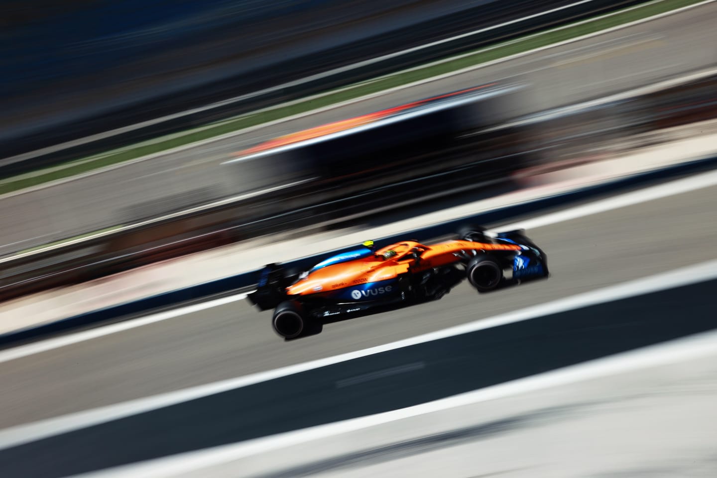 Norris flashes past in the McLaren MCL35M