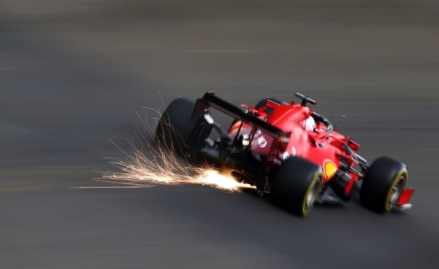 SPA, BELGIUM - AUGUST 27: Sparks fly behind Charles Leclerc of Monaco driving the (16) Scuderia