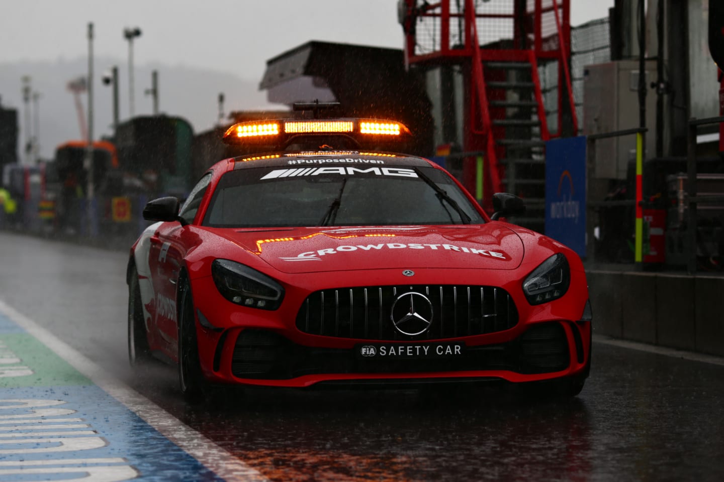 SPA, BELGIUM - AUGUST 28: The FIA Safety Car drives in a rain filled pitlane prior to qualifying