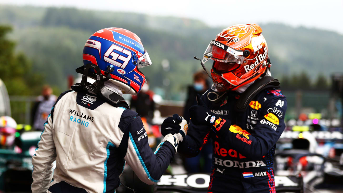 SPA, BELGIUM - AUGUST 28: Pole position qualifier Max Verstappen of Netherlands and Red Bull Racing and second place qualifier George Russell of Great Britain and Williams celebrate in parc ferme during qualifying ahead of the F1 Grand Prix of Belgium at Circuit de Spa-Francorchamps on August 28, 2021 in Spa, Belgium. (Photo by Dan Istitene - Formula 1/Formula 1 via Getty Images)