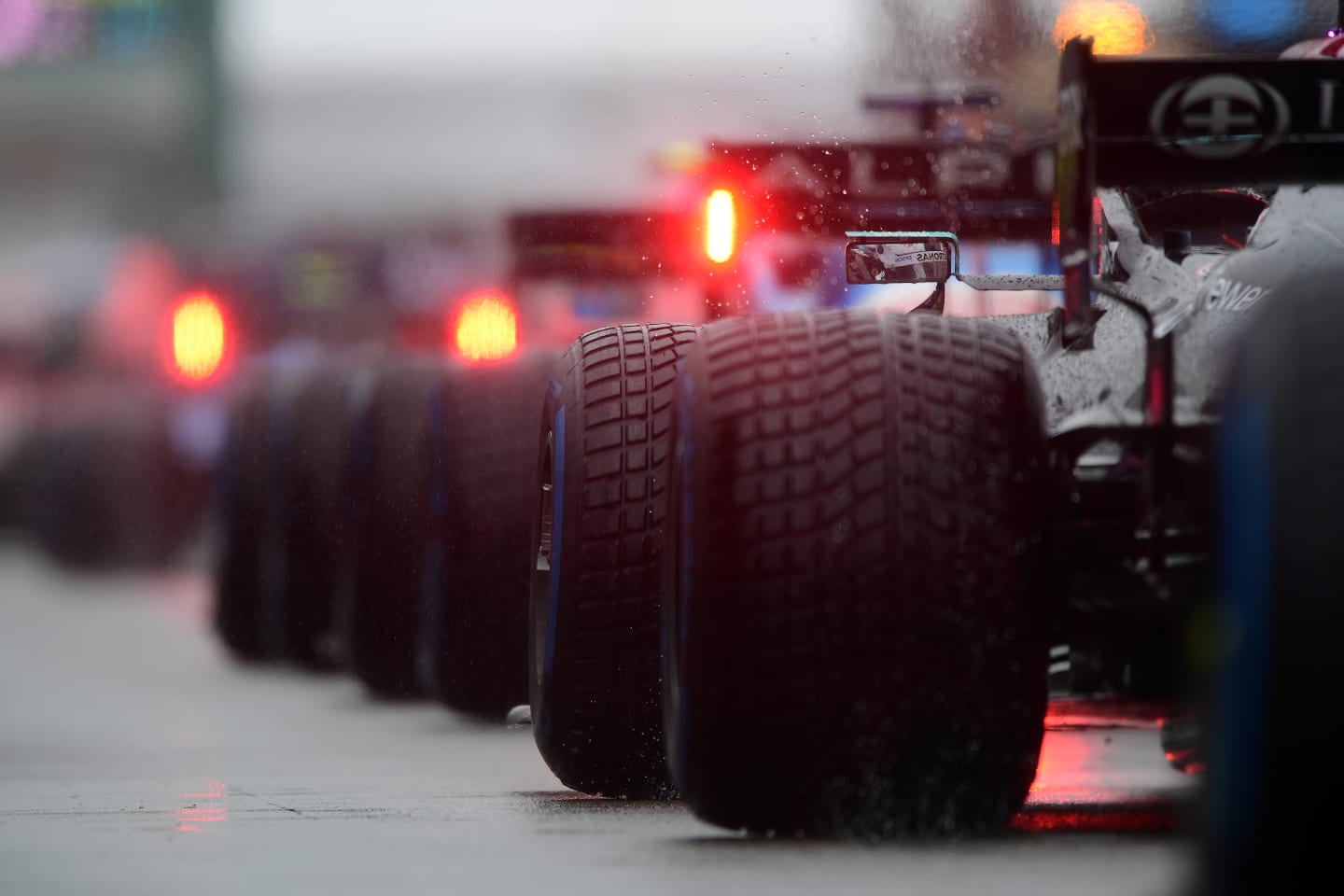 SPA, BELGIUM - AUGUST 29: A detail shot of rain spraying from tyres in the Pitlane during the F1