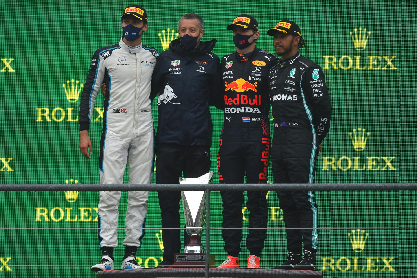 SPA, BELGIUM - AUGUST 29: Race winner Max Verstappen of Netherlands and Red Bull Racing, second placed George Russell of Great Britain and Williams and third placed Lewis Hamilton of Great Britain and Mercedes GP celebrate on the podium during the F1 Grand Prix of Belgium at Circuit de Spa-Francorchamps on August 29, 2021 in Spa, Belgium. (Photo by Dan Mullan/Getty Images)