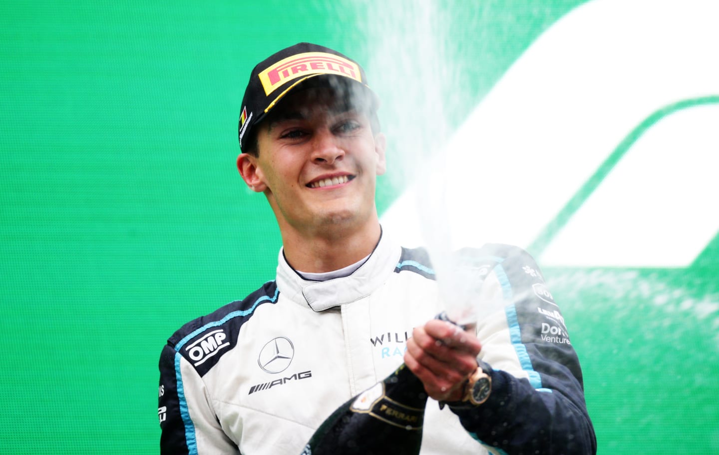 SPA, BELGIUM - AUGUST 29: Second placed George Russell of Great Britain and Williams celebrates on the podium during the F1 Grand Prix of Belgium at Circuit de Spa-Francorchamps on August 29, 2021 in Spa, Belgium. (Photo by Peter Fox/Getty Images)