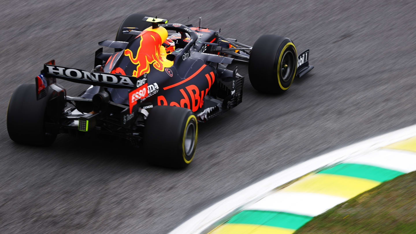 SAO PAULO, BRAZIL - NOVEMBER 12: Sergio Perez of Mexico driving the (11) Red Bull Racing RB16B Honda during practice ahead of the F1 Grand Prix of Brazil at Autodromo Jose Carlos Pace on November 12, 2021 in Sao Paulo, Brazil. (Photo by Bryn Lennon - Formula 1/Formula 1 via Getty Images)