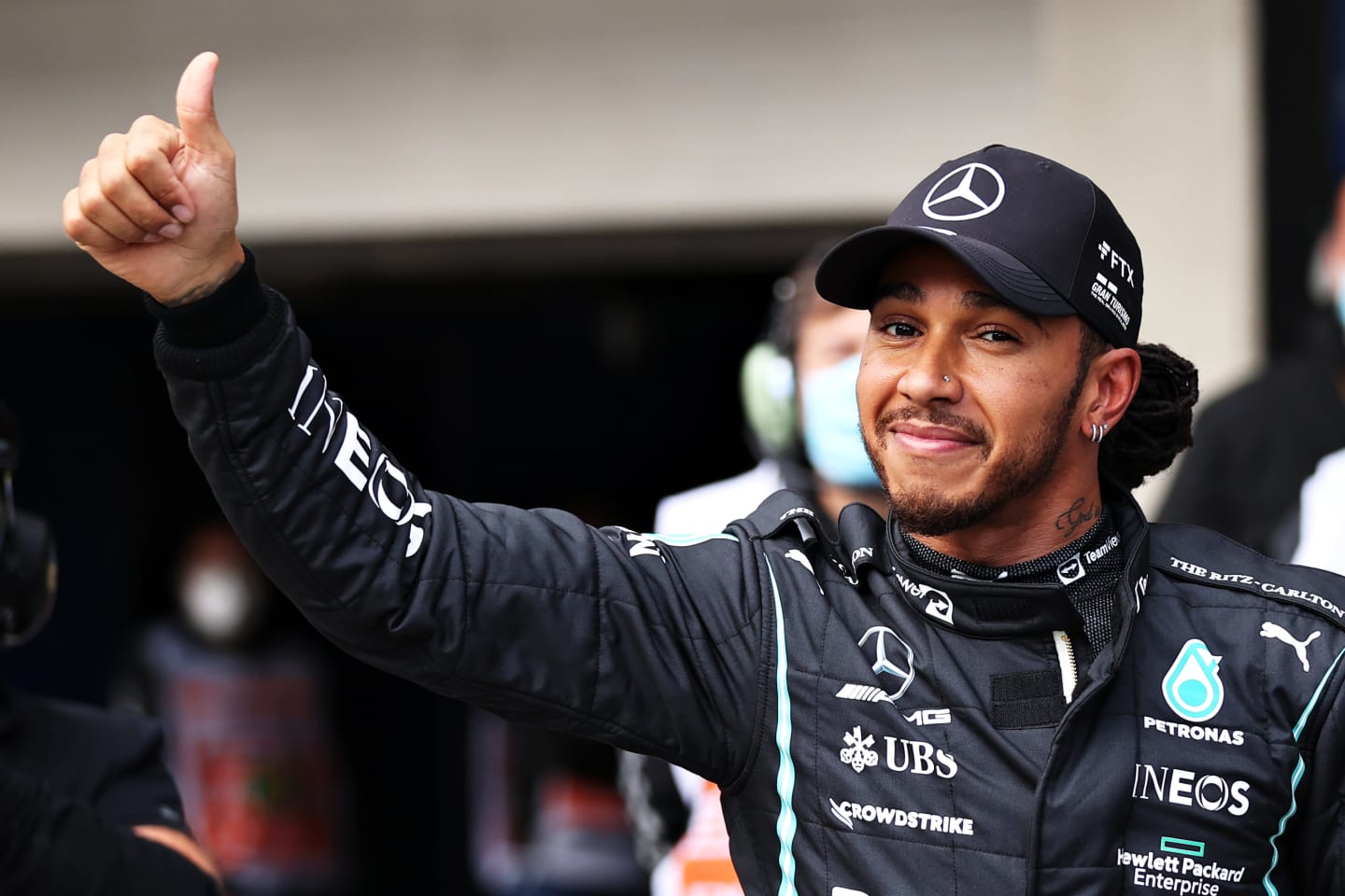 SAO PAULO, BRAZIL - NOVEMBER 12: Fastest qualifier Lewis Hamilton of Great Britain and Mercedes GP celebrates in parc ferme during qualifying ahead of the F1 Grand Prix of Brazil at Autodromo Jose Carlos Pace on November 12, 2021 in Sao Paulo, Brazil. (Photo by Lars Baron/Getty Images)