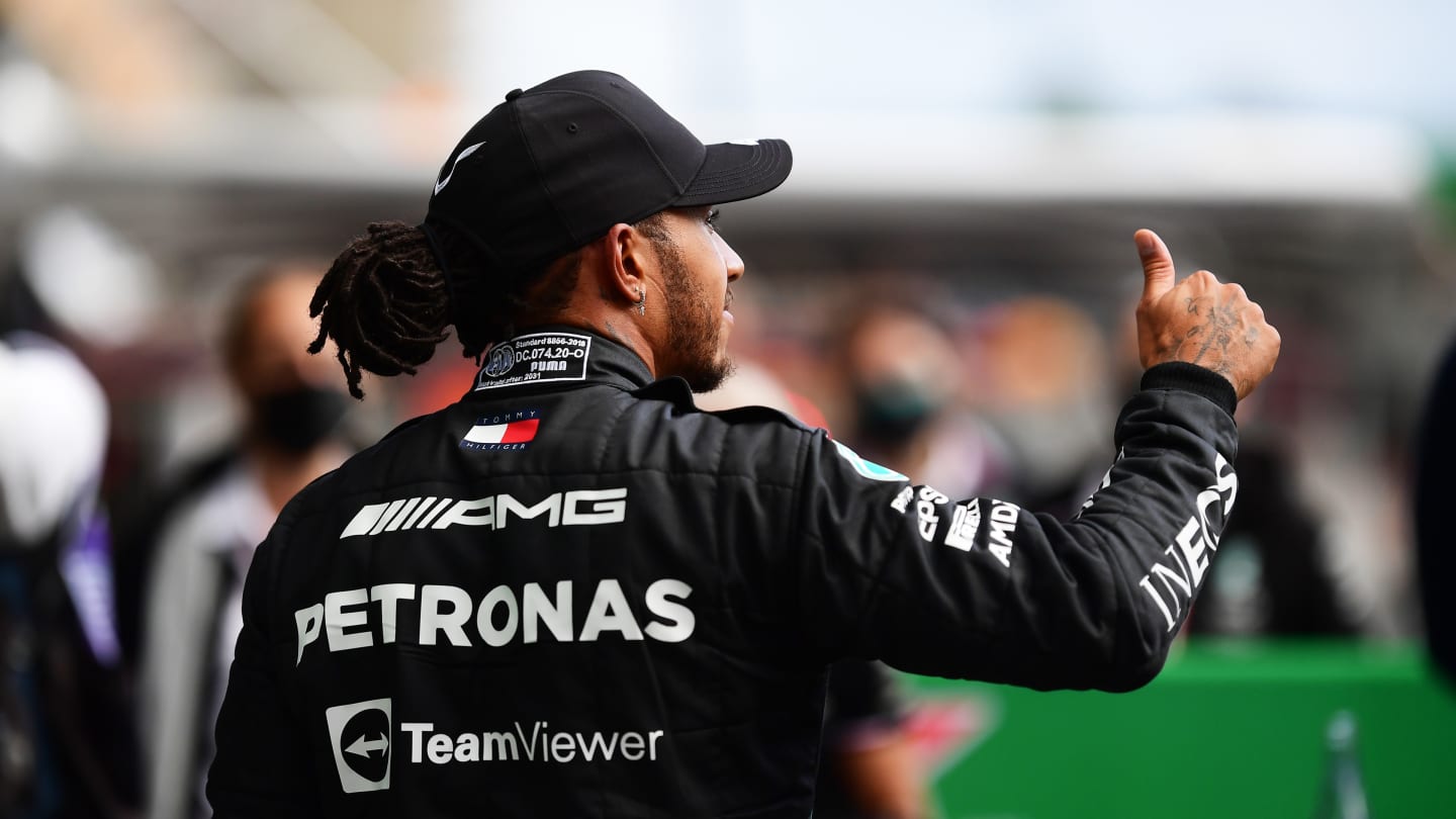 SAO PAULO, BRAZIL - NOVEMBER 12: Fastest qualifier Lewis Hamilton of Great Britain and Mercedes GP