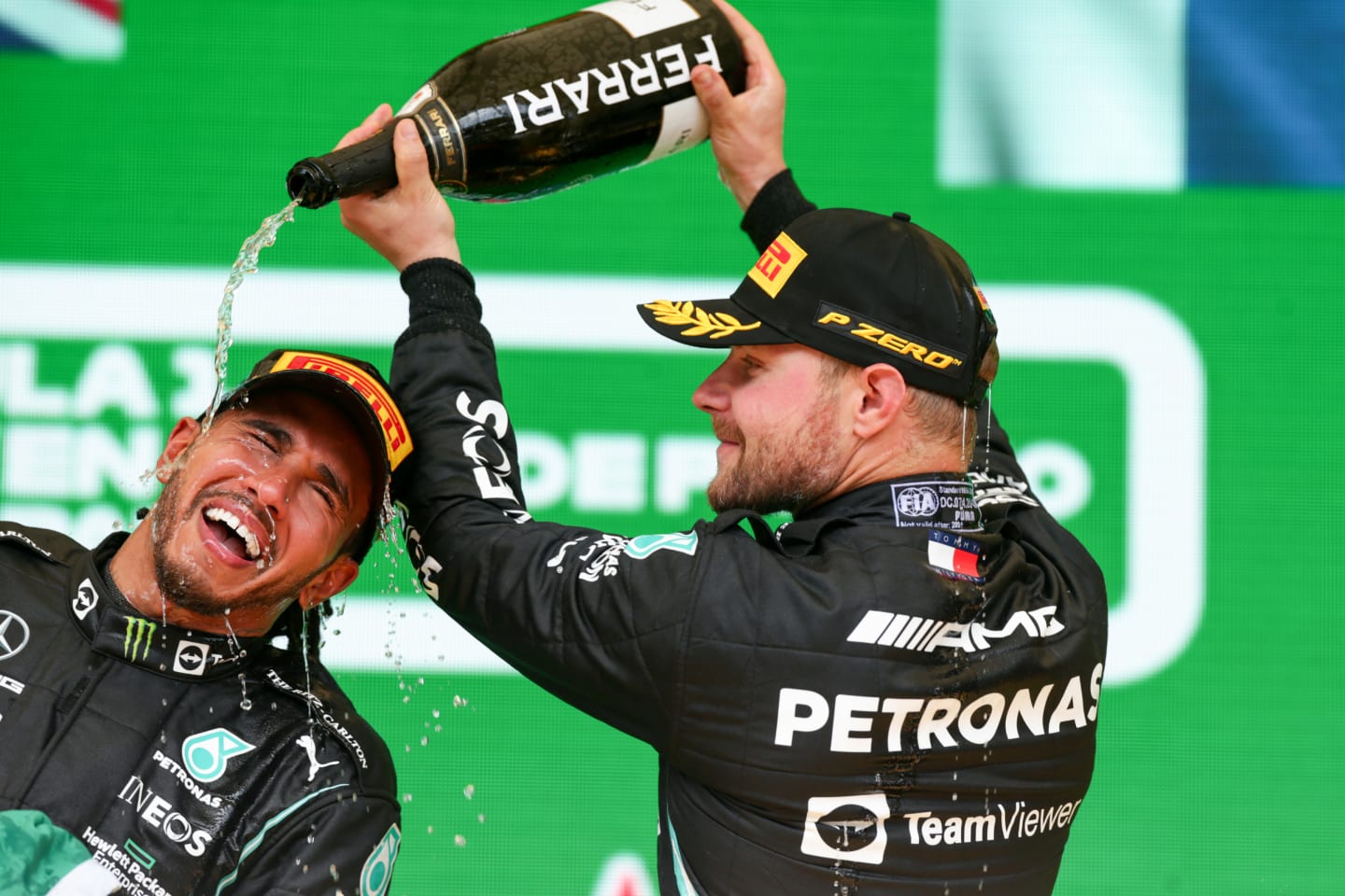SAO PAULO, BRAZIL - NOVEMBER 14: Lewis Hamilton of Mercedes and Great Britain and Valterri Bottas of Mercedes and Finland celebrate finishing in first and third positions during the F1 Grand Prix of Brazil at Autodromo Jose Carlos Pace on November 14, 2021 in Sao Paulo, Brazil. (Photo by Peter Fox/Getty Images)
