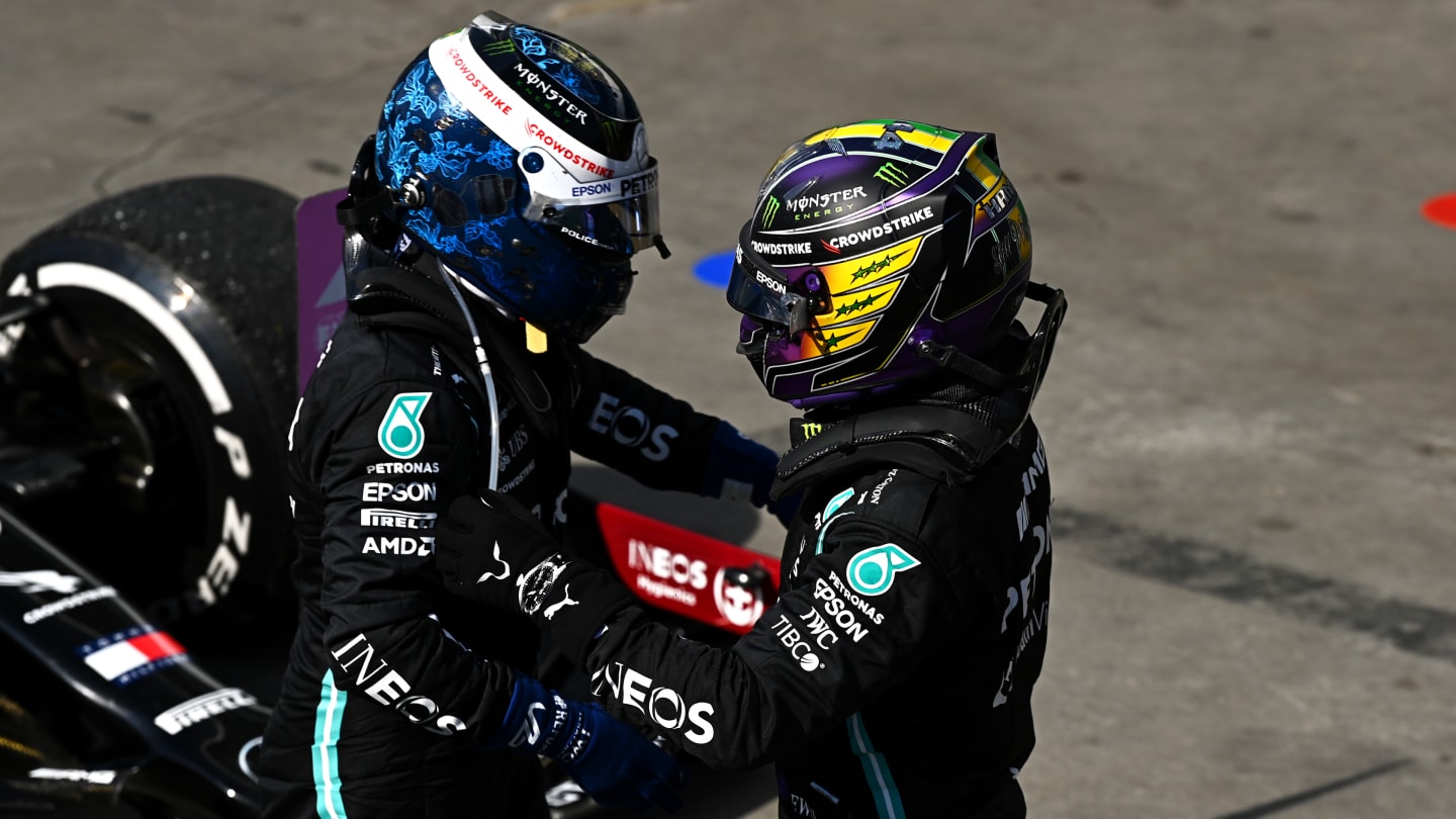 SAO PAULO, BRAZIL - NOVEMBER 14: Race winner Lewis Hamilton of Great Britain and Mercedes GP celebrates with teammate and third placed Valtteri Bottas of Finland and Mercedes GP in parc ferme during the F1 Grand Prix of Brazil at Autodromo Jose Carlos Pace on November 14, 2021 in Sao Paulo, Brazil. (Photo by Clive Mason - Formula 1/Formula 1 via Getty Images)