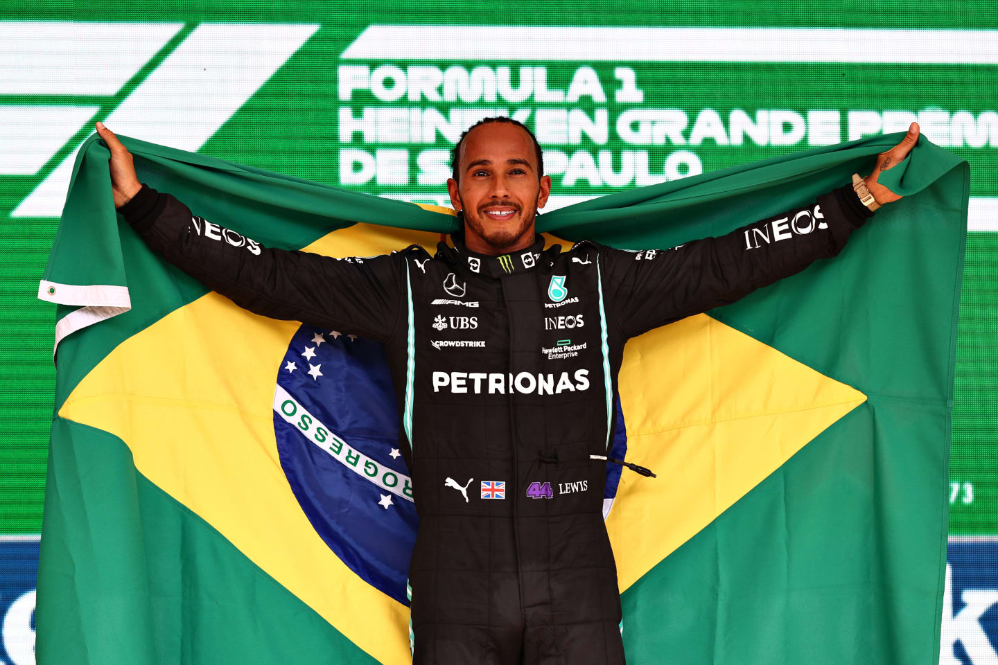 SAO PAULO, BRAZIL - NOVEMBER 14: Race winner Lewis Hamilton of Great Britain and Mercedes GP celebrates on the podium during the F1 Grand Prix of Brazil at Autodromo Jose Carlos Pace on November 14, 2021 in Sao Paulo, Brazil. (Photo by Mark Thompson/Getty Images)