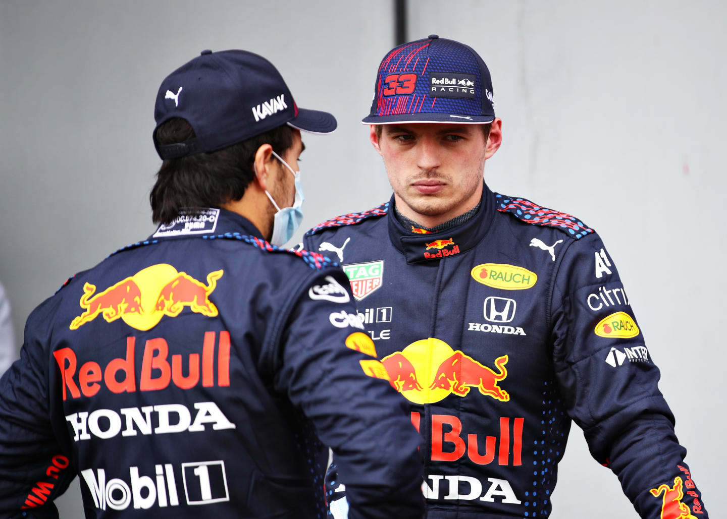 IMOLA, ITALY - APRIL 17: Second place qualifier Sergio Perez of Mexico and Red Bull Racing and third place qualifier Max Verstappen of Netherlands and Red Bull Racing talk in parc ferme during qualifying ahead of the F1 Grand Prix of Emilia Romagna at Autodromo Enzo e Dino Ferrari on April 17, 2021 in Imola, Italy. (Photo by Mark Thompson/Getty Images)