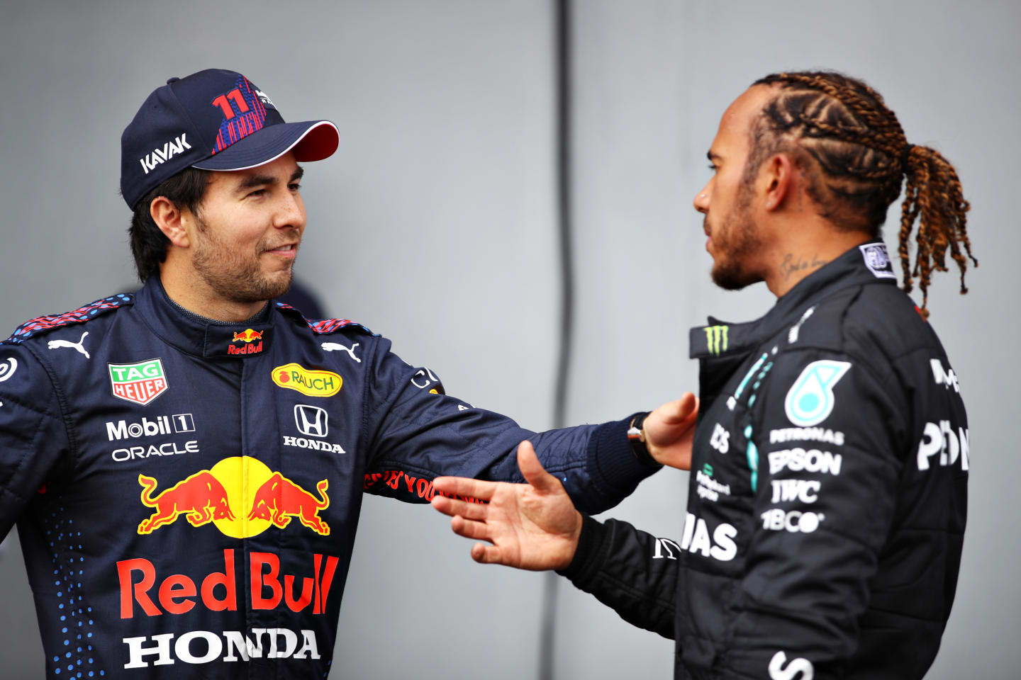 IMOLA, ITALY - APRIL 17: Second place qualifier Sergio Perez of Mexico and Red Bull Racing and pole position qualifier Lewis Hamilton of Great Britain and Mercedes GP talk in parc ferme during qualifying ahead of the F1 Grand Prix of Emilia Romagna at Autodromo Enzo e Dino Ferrari on April 17, 2021 in Imola, Italy. (Photo by Mark Thompson/Getty Images)