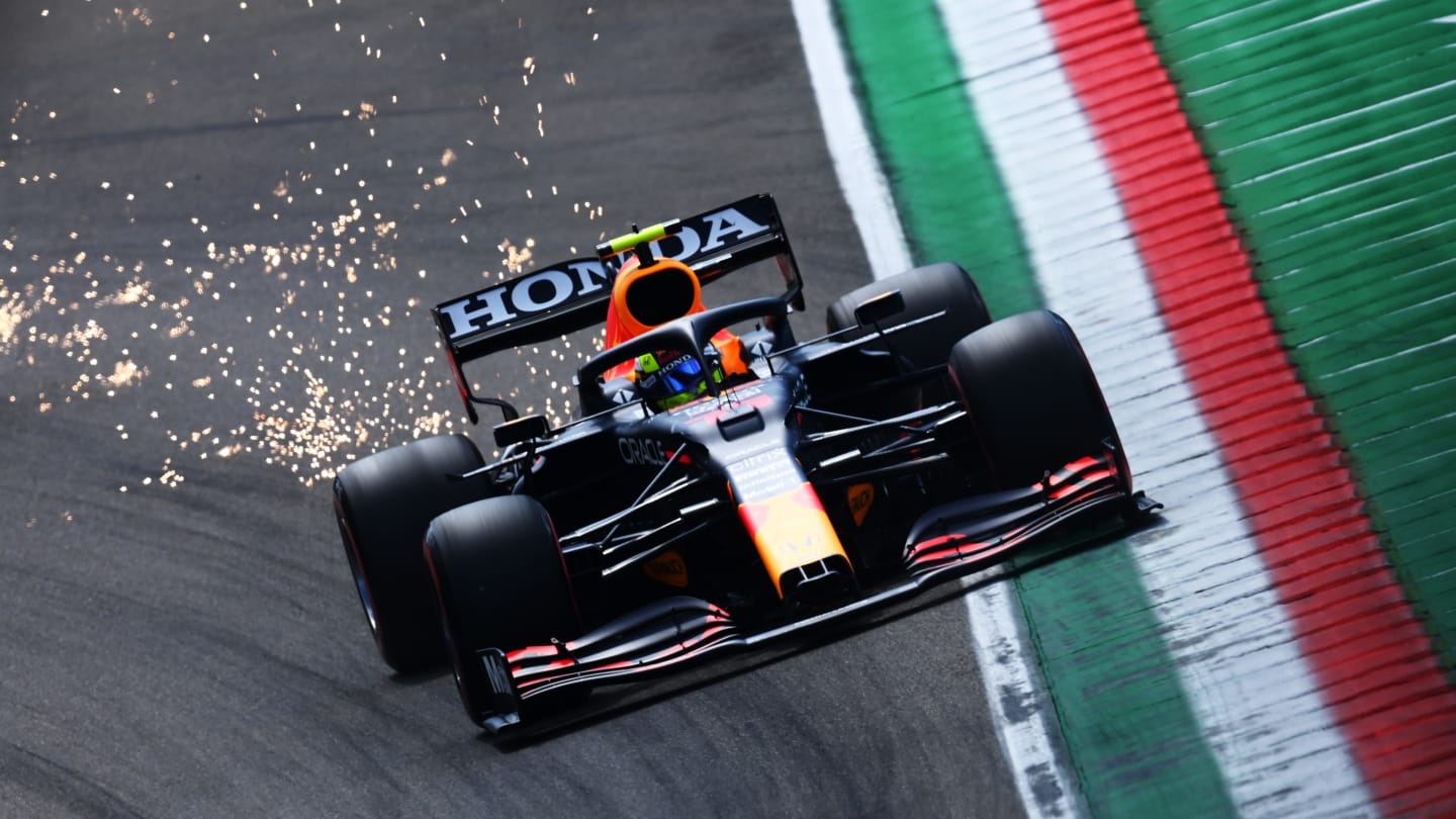 IMOLA, ITALY - APRIL 17: Sparks fly behind Sergio Perez of Mexico driving the (11) Red Bull Racing