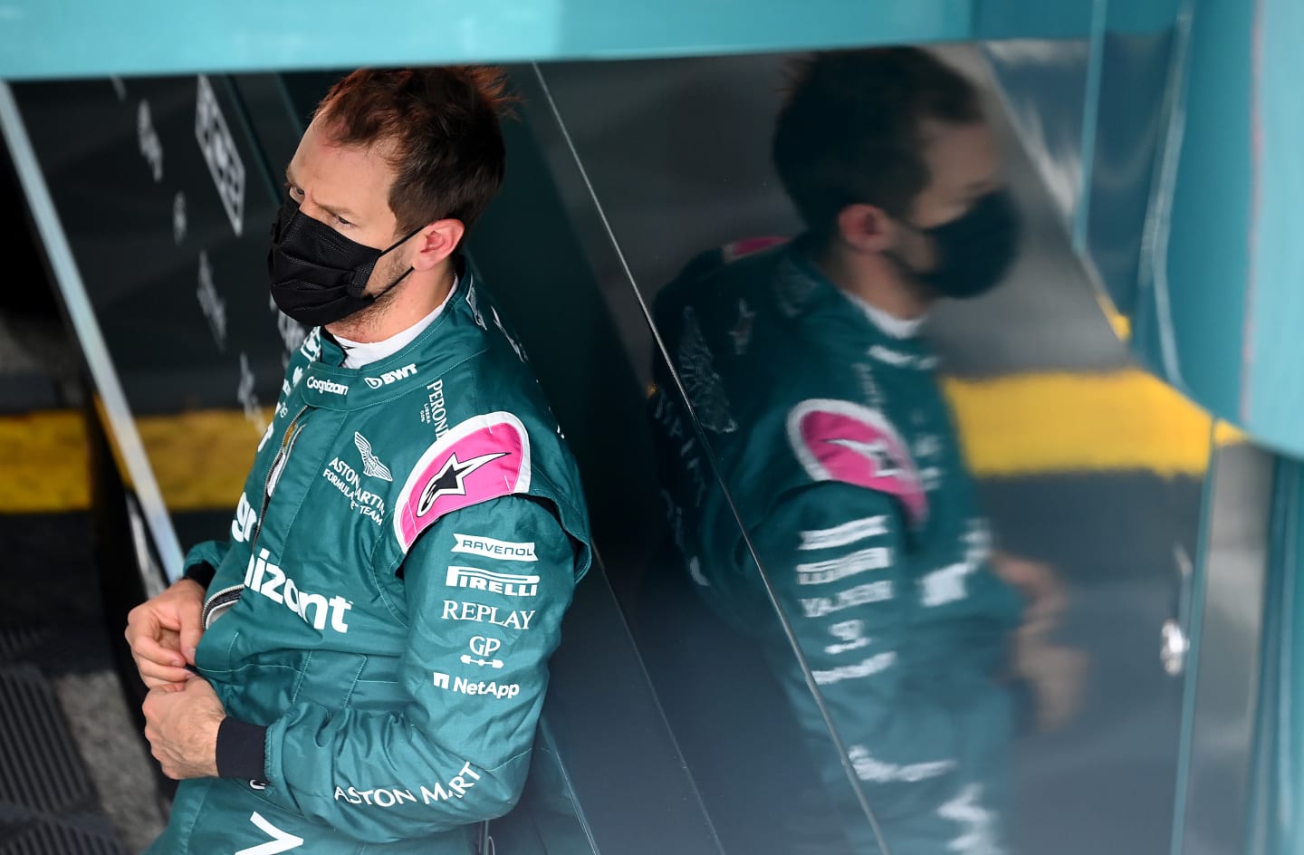 IMOLA, ITALY - APRIL 17: Sebastian Vettel of Germany and Aston Martin F1 Team looks on in the Paddock during final practice ahead of the F1 Grand Prix of Emilia Romagna at Autodromo Enzo e Dino Ferrari on April 17, 2021 in Imola, Italy. (Photo by Clive Mason - Formula 1/Formula 1 via Getty Images)