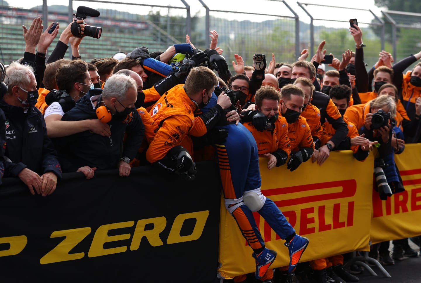 IMOLA, ITALY - APRIL 18: Third placed Lando Norris of Great Britain and McLaren F1 celebrates in parc ferme with his team during the F1 Grand Prix of Emilia Romagna at Autodromo Enzo e Dino Ferrari on April 18, 2021 in Imola, Italy. (Photo by Bryn Lennon/Getty Images)