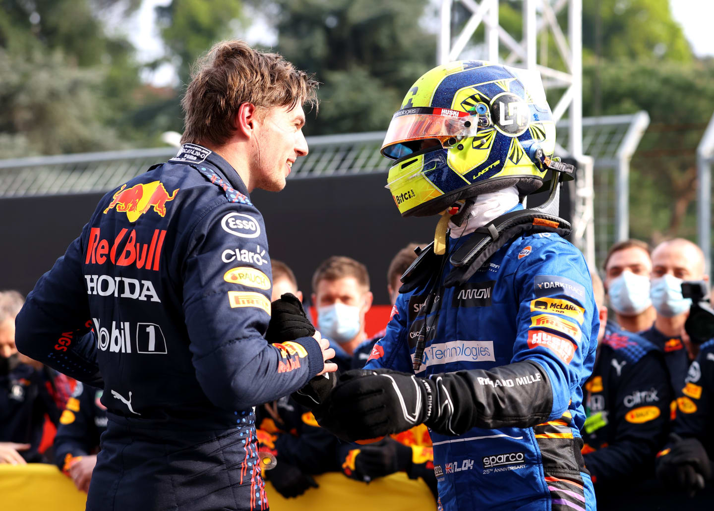 IMOLA, ITALY - APRIL 18: Race winner Max Verstappen of Netherlands and Red Bull Racing and third placed Lando Norris of Great Britain and McLaren F1 celebrate in parc ferme during the F1 Grand Prix of Emilia Romagna at Autodromo Enzo e Dino Ferrari on April 18, 2021 in Imola, Italy. (Photo by Bryn Lennon/Getty Images)