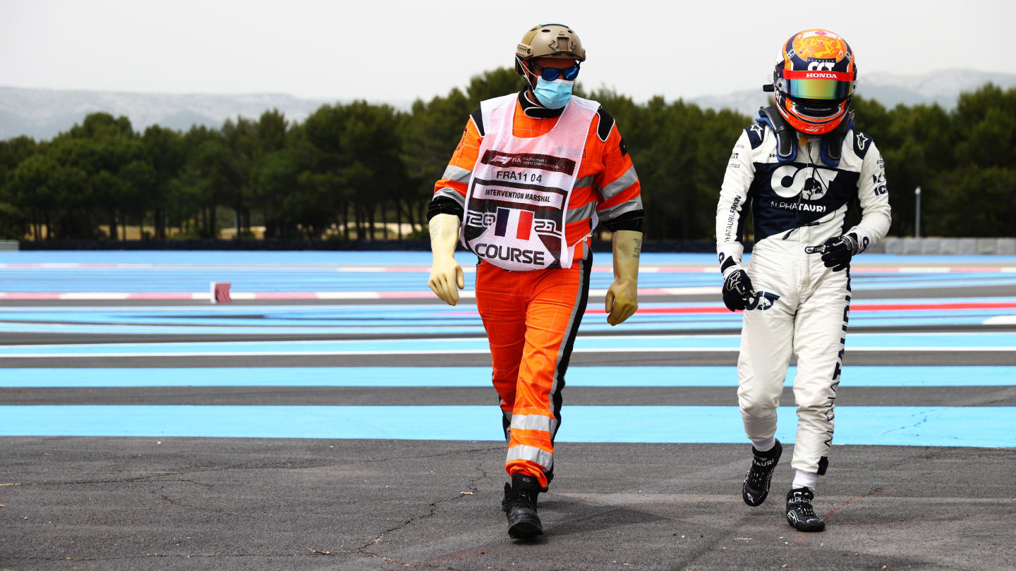 LE CASTELLET, FRANCE - JUNE 19: Yuki Tsunoda of Japan and Scuderia AlphaTauri walks off the circuit after spinning during qualifying ahead of the F1 Grand Prix of France at Circuit Paul Ricard on June 19, 2021 in Le Castellet, France. (Photo by Dan Istitene - Formula 1/Formula 1 via Getty Images)