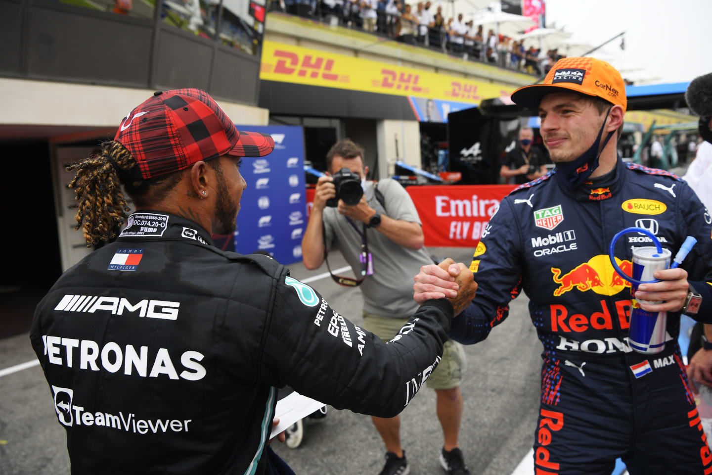 LE CASTELLET, FRANCE - JUNE 19: Pole position qualifier Max Verstappen of Netherlands and Red Bull Racing and second placed qualifier Lewis Hamilton of Great Britain and Mercedes GP interact in parc ferme during qualifying ahead of the F1 Grand Prix of France at Circuit Paul Ricard on June 19, 2021 in Le Castellet, France. (Photo by Nicolas Tucat - Pool/Getty Images)