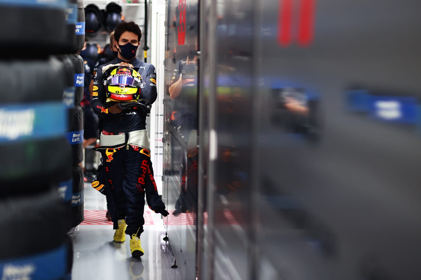 LE CASTELLET, FRANCE - JUNE 19: Sergio Perez of Mexico and Red Bull Racing walks in the garage during qualifying ahead of the F1 Grand Prix of France at Circuit Paul Ricard on June 19, 2021 in Le Castellet, France. (Photo by Mark Thompson/Getty Images)