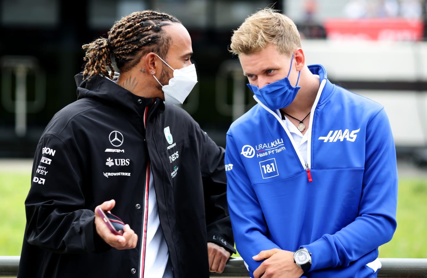 LE CASTELLET, FRANCE - JUNE 20: Lewis Hamilton of Great Britain and Mercedes GP talks with Mick Schumacher of Germany and Haas F1 during the F1 Grand Prix of France at Circuit Paul Ricard on June 20, 2021 in Le Castellet, France. (Photo by Peter Fox/Getty Images)