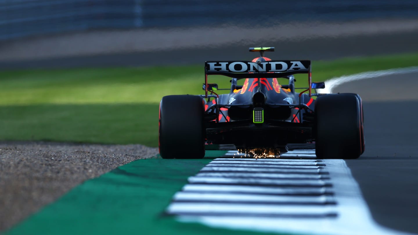 NORTHAMPTON, ENGLAND - JULY 16: Sergio Perez of Mexico driving the (11) Red Bull Racing RB16B Honda during qualifying ahead of the F1 Grand Prix of Great Britain at Silverstone on July 16, 2021 in Northampton, England. (Photo by Bryn Lennon - Formula 1/Formula 1 via Getty Images)