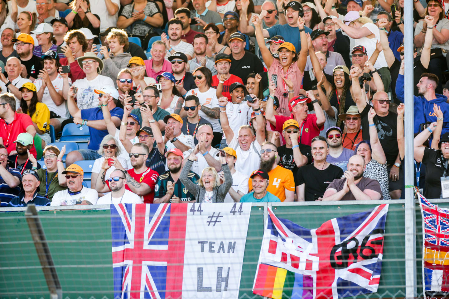 NORTHAMPTON, ENGLAND - JULY 16: Fans of Lewis Hamilton celebrate him taking Pole Position during