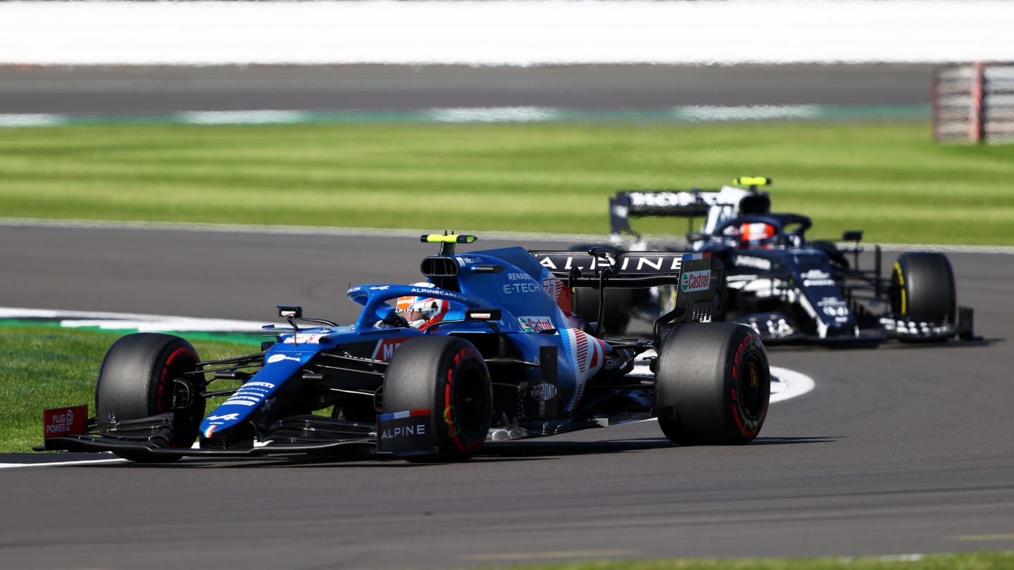 NORTHAMPTON, ENGLAND - JULY 17: Esteban Ocon of France driving the (31) Alpine A521 Renault leads Pierre Gasly of France driving the (10) Scuderia AlphaTauri AT02 Honda during the Sprint for the F1 Grand Prix of Great Britain at Silverstone on July 17, 2021 in Northampton, England. (Photo by Bryn Lennon - Formula 1/Formula 1 via Getty Images)