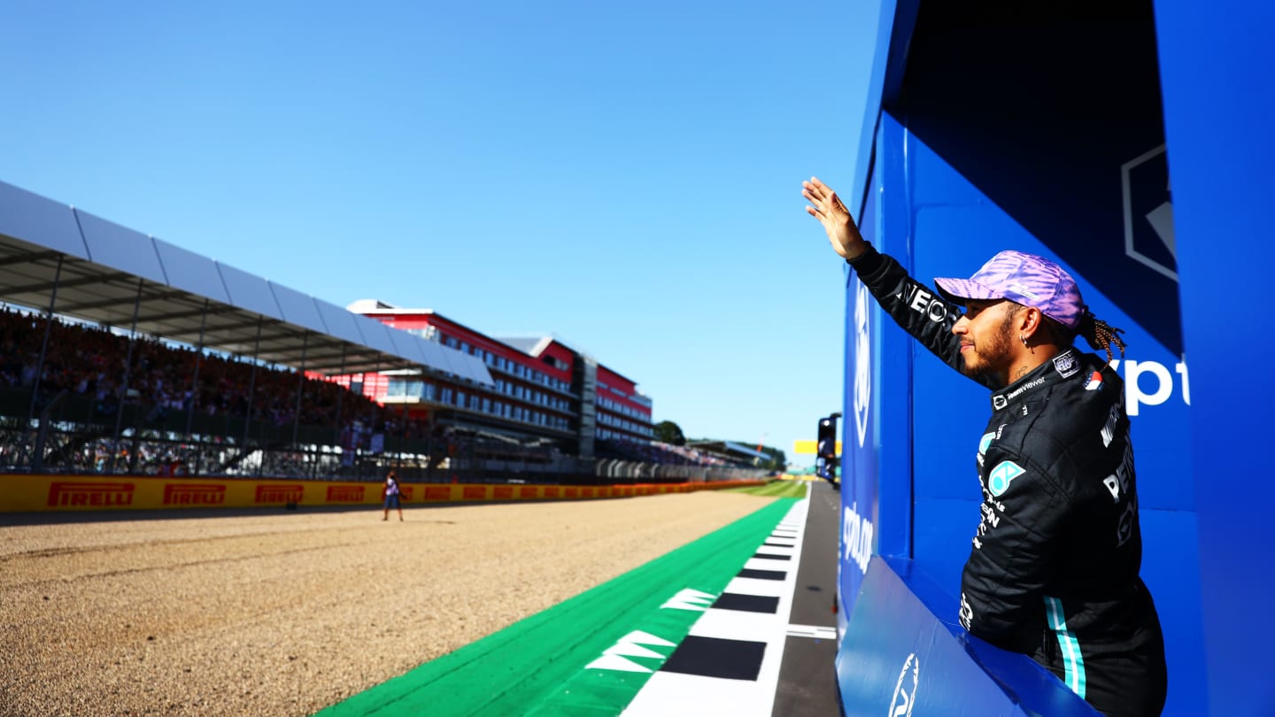 NORTHAMPTON, ENGLAND - JULY 17: Second placed Lewis Hamilton of Great Britain and Mercedes GP waves