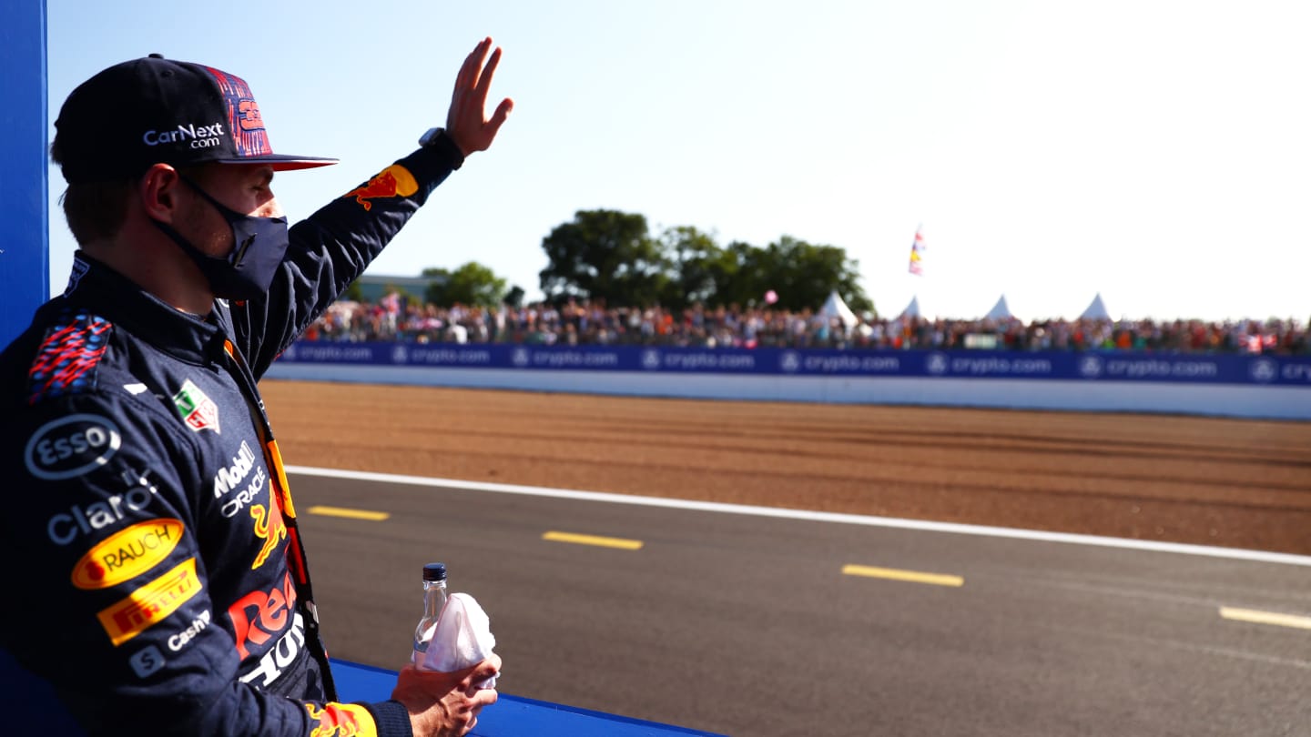 NORTHAMPTON, ENGLAND - JULY 17: Winner Max Verstappen of Netherlands and Red Bull Racing waves to the crowd on the Victory Lap during the Sprint for the F1 Grand Prix of Great Britain at Silverstone on July 17, 2021 in Northampton, England. (Photo by Dan Istitene - Formula 1/Formula 1 via Getty Images)