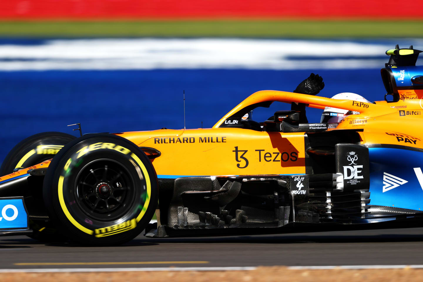 NORTHAMPTON, ENGLAND - JULY 17: Lando Norris of Great Britain driving the (4) McLaren F1 Team MCL35M Mercedes waves to the crowd during the Sprint for the F1 Grand Prix of Great Britain at Silverstone on July 17, 2021 in Northampton, England. (Photo by Bryn Lennon - Formula 1/Formula 1 via Getty Images)