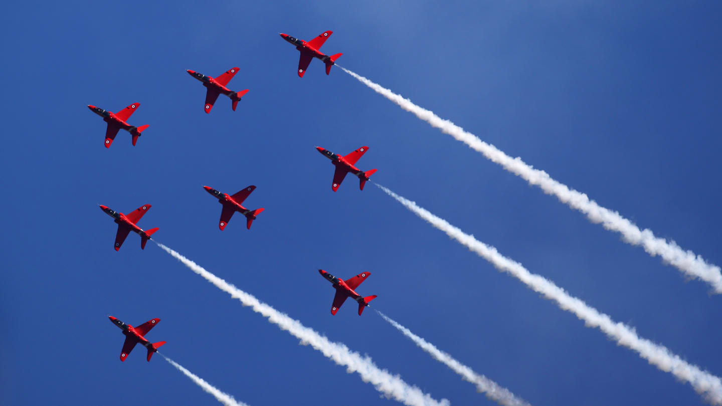 NORTHAMPTON, ENGLAND - JULY 18: The Red Arrows perform above the circuit before the F1 Grand Prix