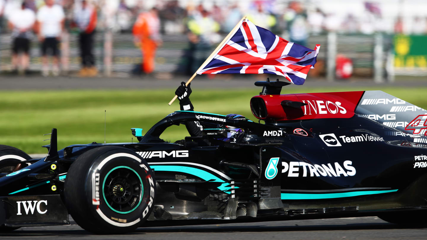 NORTHAMPTON, ENGLAND - JULY 18: Race winner Lewis Hamilton of Great Britain driving the (44)