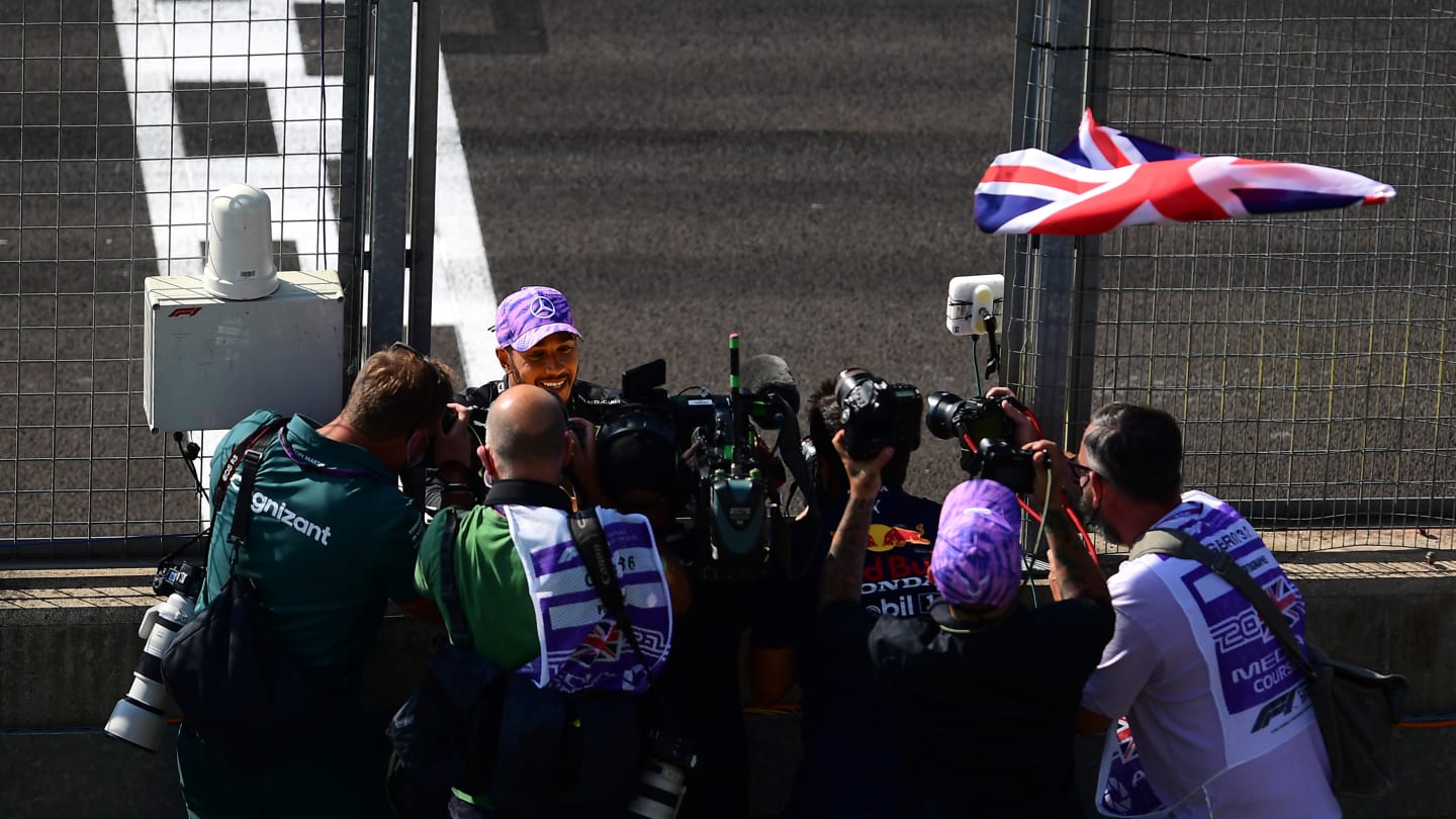 NORTHAMPTON, ENGLAND - JULY 18: Race winner Lewis Hamilton of Great Britain and Mercedes GP celebrates in parc ferme during the F1 Grand Prix of Great Britain at Silverstone on July 18, 2021 in Northampton, England. (Photo by Mario Renzi - Formula 1/Formula 1 via Getty Images)