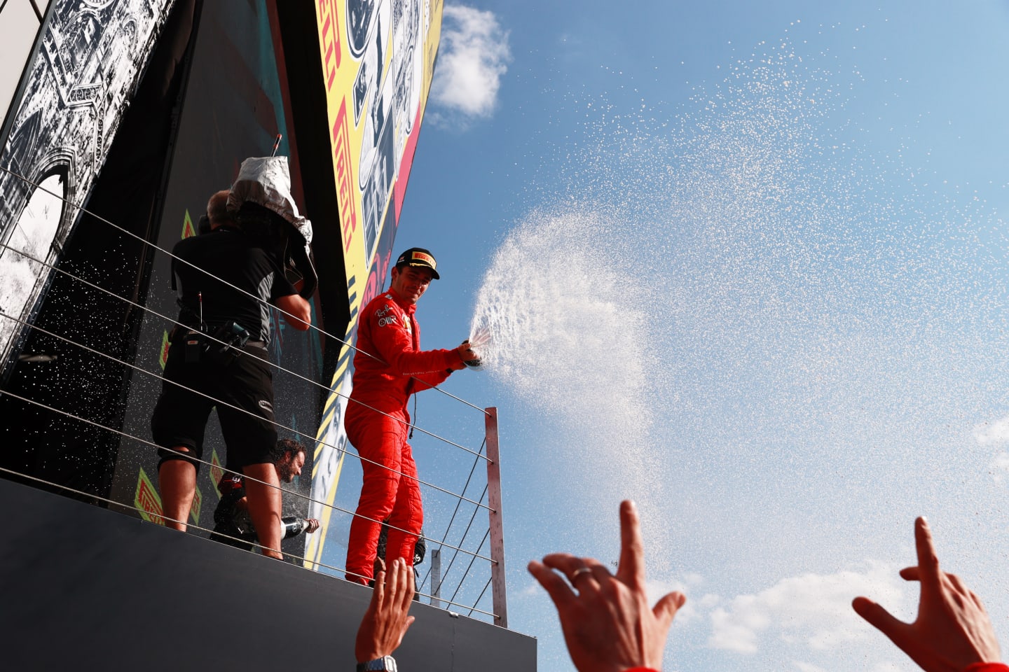 NORTHAMPTON, ENGLAND - JULY 18: Second placed Charles Leclerc of Monaco and Ferrari celebrates on the podium  during the F1 Grand Prix of Great Britain at Silverstone on July 18, 2021 in Northampton, England. (Photo by Mark Thompson/Getty Images)