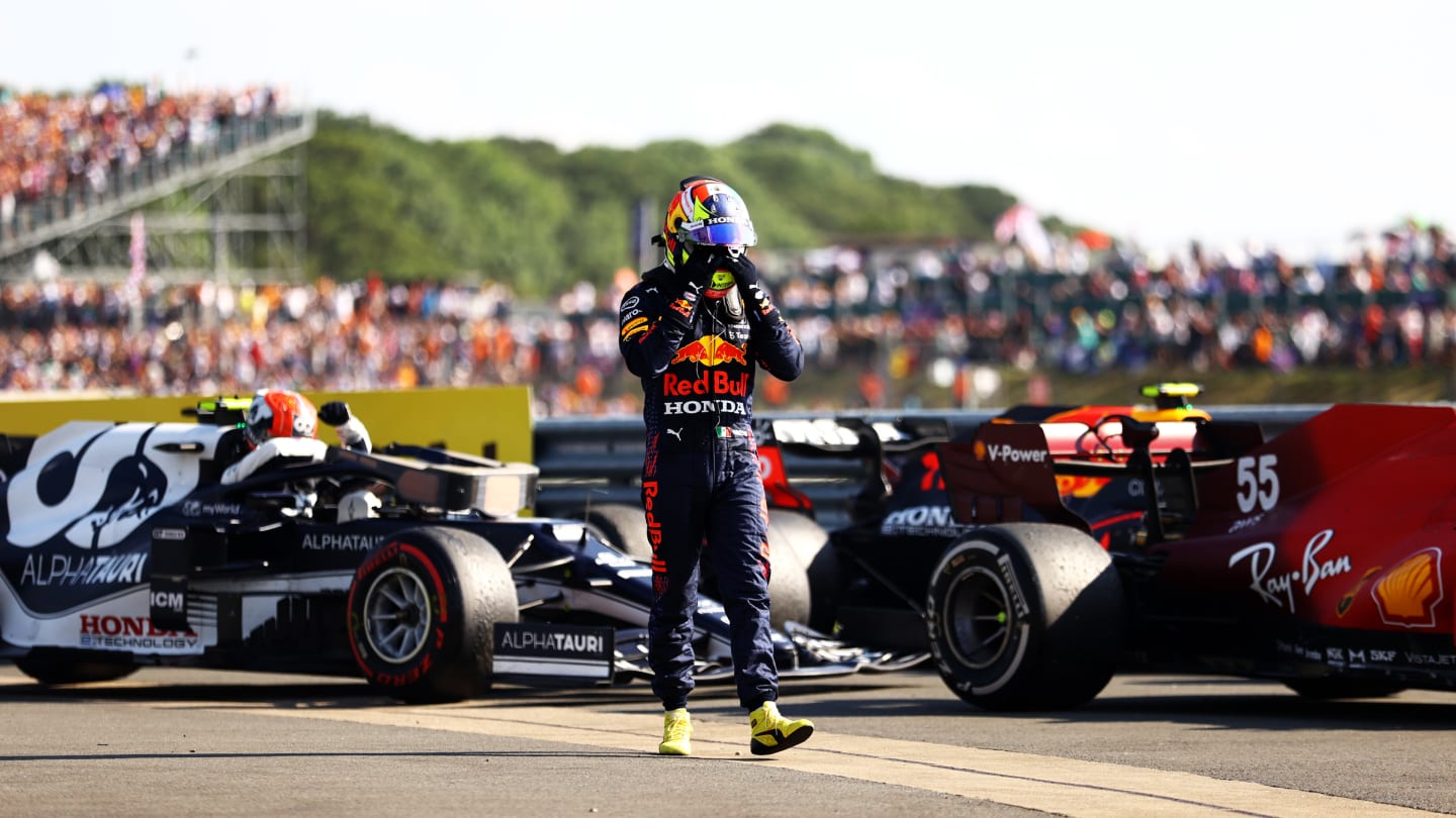 NORTHAMPTON, ENGLAND - JULY 18: Sergio Perez of Mexico and Red Bull Racing walks in parc ferme