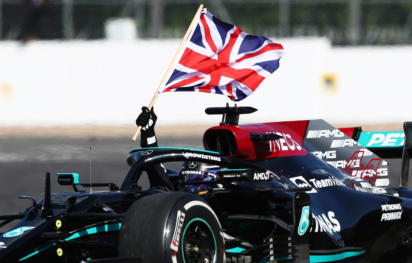 NORTHAMPTON, ENGLAND - JULY 18: Race winner Lewis Hamilton of Great Britain driving the (44)