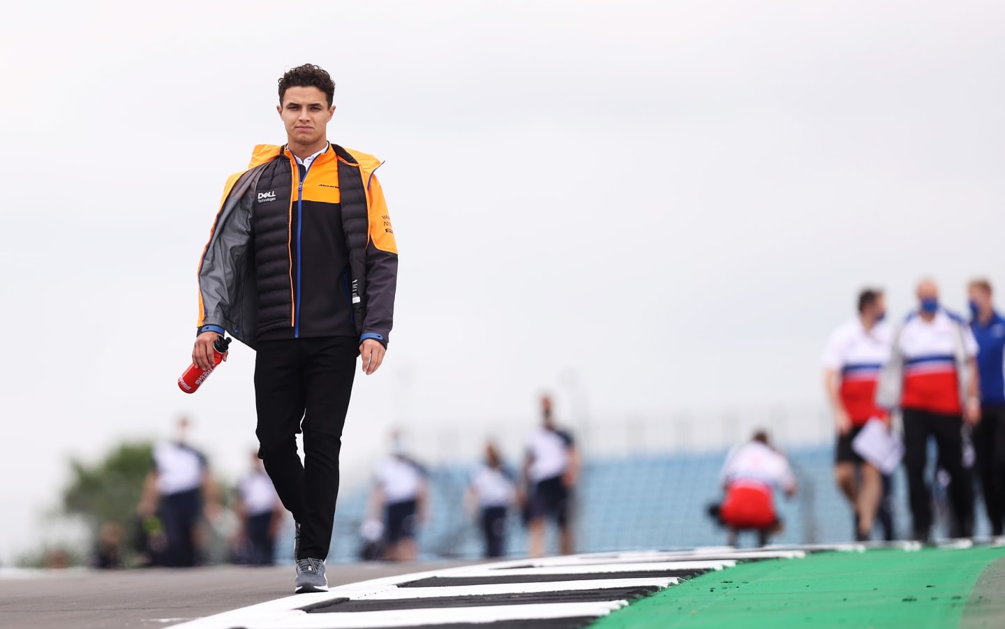 NORTHAMPTON, ENGLAND - JULY 15: Lando Norris of Great Britain and McLaren F1 walks the track during