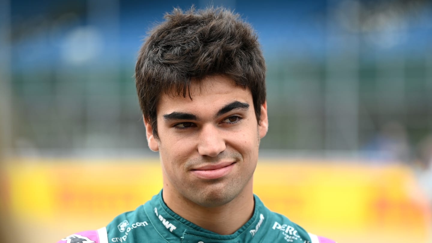 NORTHAMPTON, ENGLAND - JULY 15: Lance Stroll of Canada and Aston Martin F1 Team looks on as the
