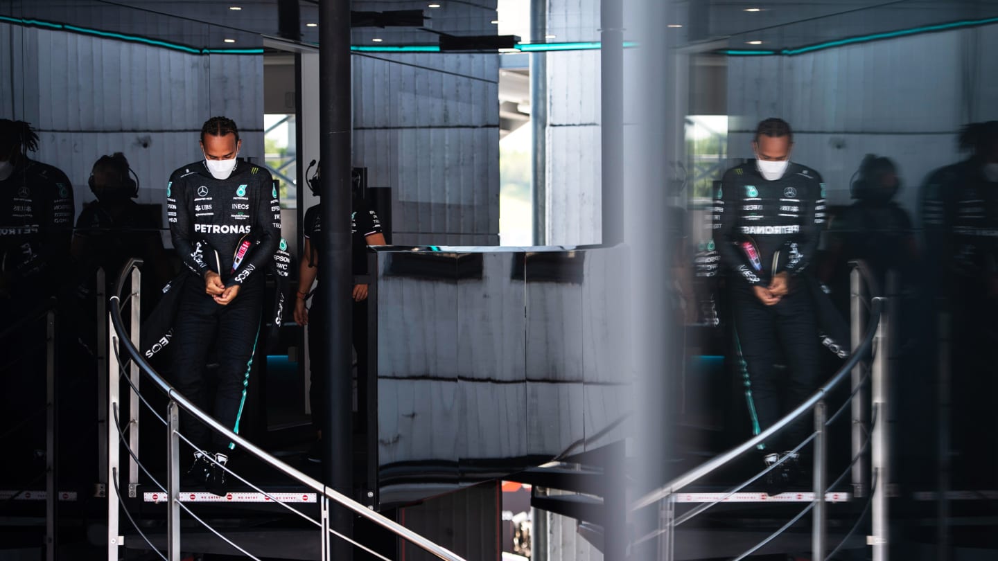 BUDAPEST, HUNGARY - JULY 30: Lewis Hamilton of Great Britain and Mercedes GP walks in the Paddock during practice ahead of the F1 Grand Prix of Hungary at Hungaroring on July 30, 2021 in Budapest, Hungary. (Photo by Rudy Carezzevoli - Formula 1/Formula 1 via Getty Images)