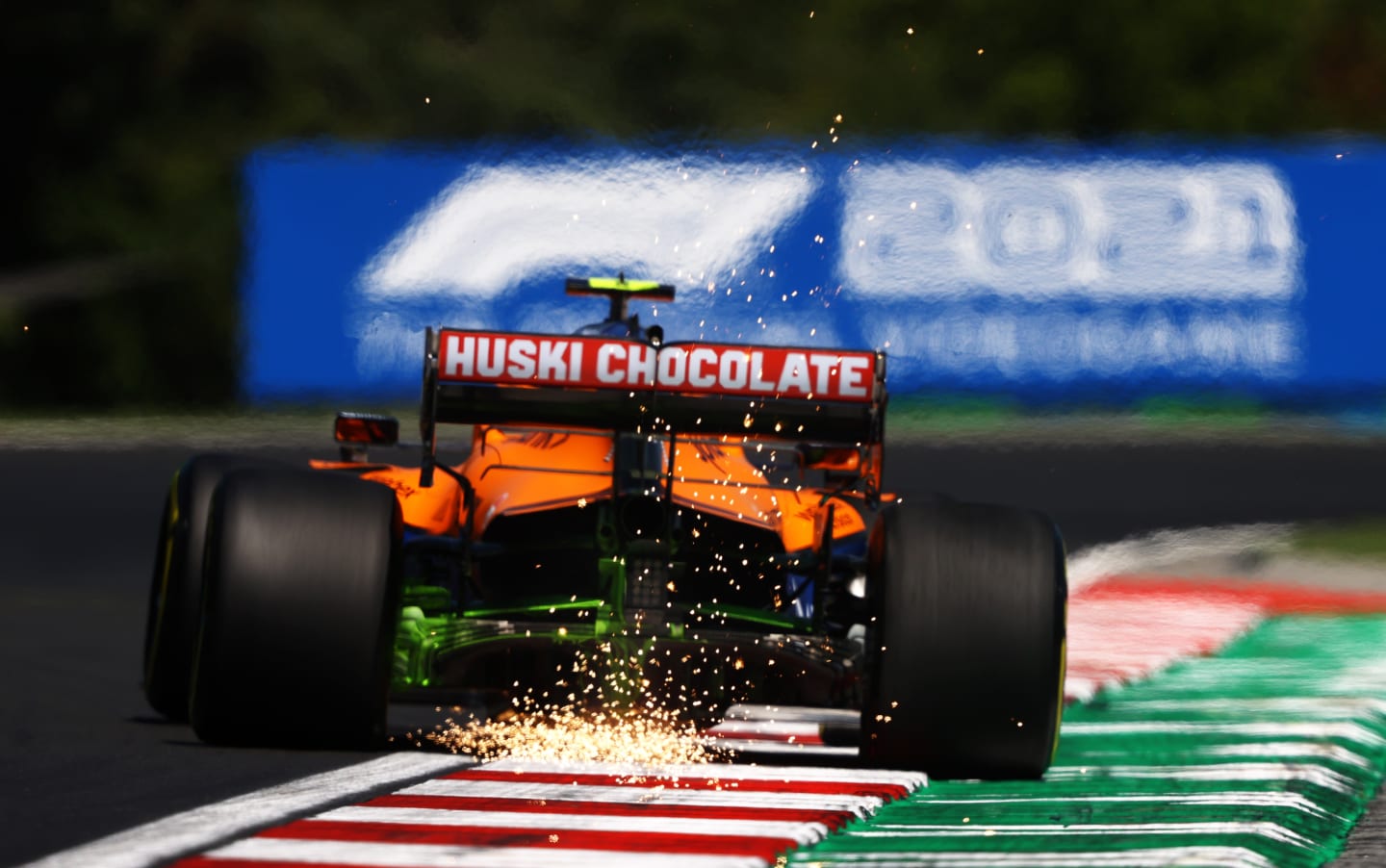 BUDAPEST, HUNGARY - JULY 30: Sparks fly behind Lando Norris of Great Britain driving the (4) McLaren F1 Team MCL35M Mercedes during practice ahead of the F1 Grand Prix of Hungary at Hungaroring on July 30, 2021 in Budapest, Hungary. (Photo by Bryn Lennon/Getty Images)