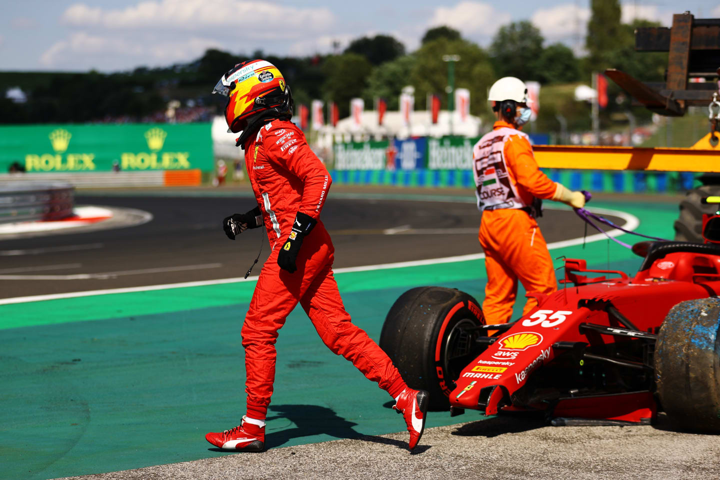 BUDAPEST, HUNGARY - JULY 31: Carlos Sainz of Spain driving the (55) Scuderia Ferrari SF21 walks