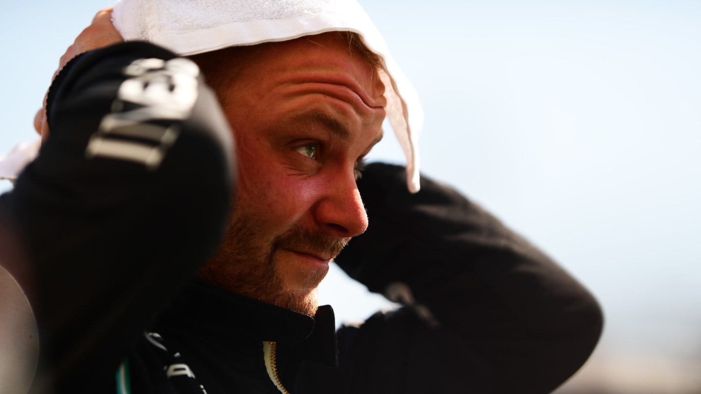 BUDAPEST, HUNGARY - JULY 31: Second place qualifier Valtteri Bottas of Finland and Mercedes GP wipes his head in parc ferme during qualifying ahead of the F1 Grand Prix of Hungary at Hungaroring on July 31, 2021 in Budapest, Hungary. (Photo by Mario Renzi - Formula 1/Formula 1 via Getty Images)
