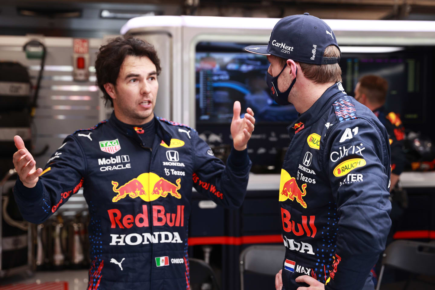 BUDAPEST, HUNGARY - AUGUST 01: Max Verstappen of Netherlands and Red Bull Racing and Sergio Perez