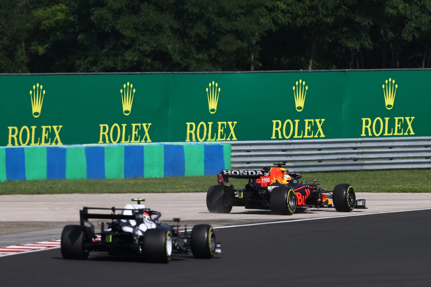 BUDAPEST, HUNGARY - AUGUST 01: Max Verstappen of the Netherlands driving the (33) Red Bull Racing RB16B Honda runs wide during the F1 Grand Prix of Hungary at Hungaroring on August 01, 2021 in Budapest, Hungary. (Photo by Bryn Lennon/Getty Images)