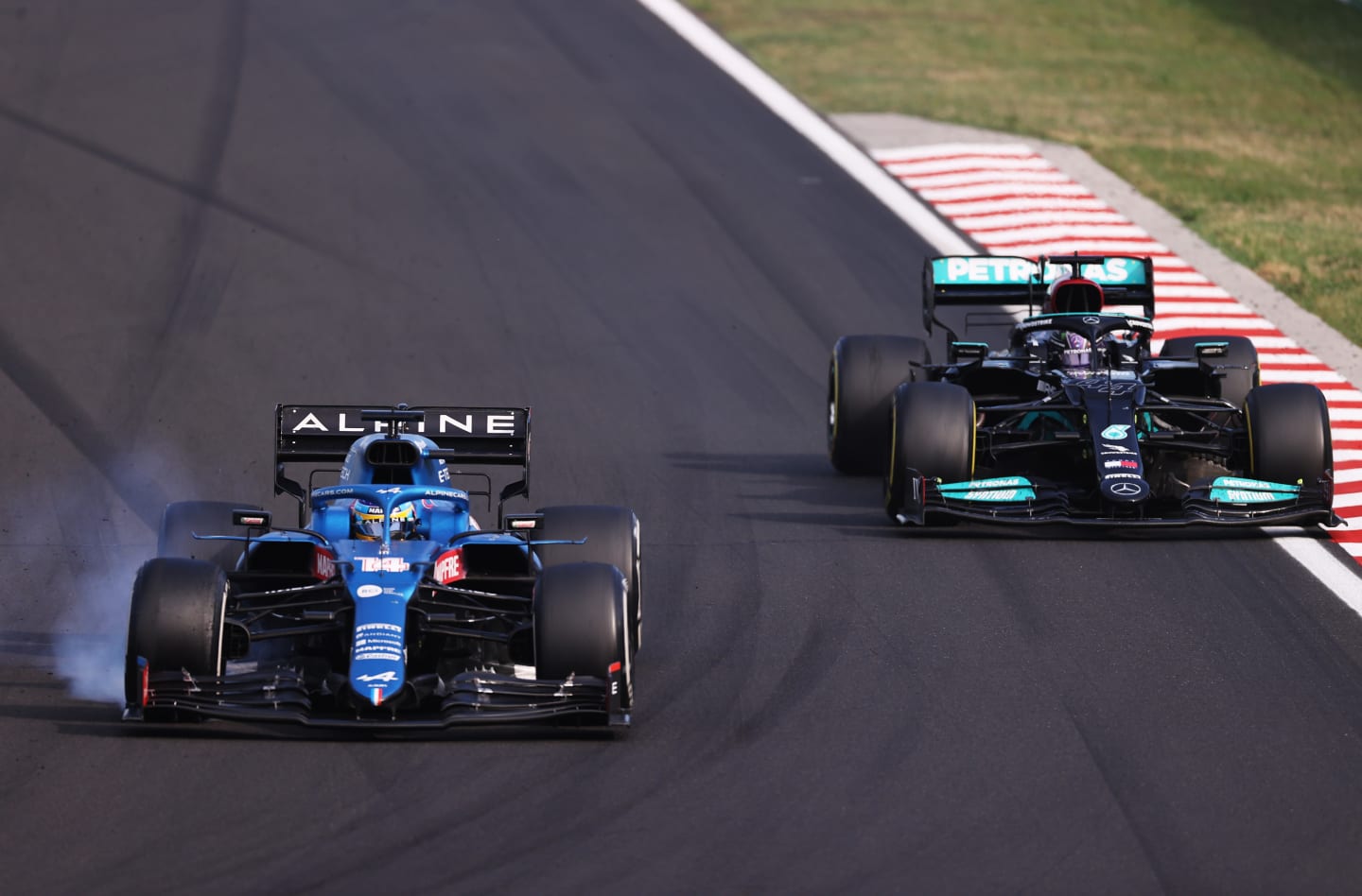 BUDAPEST, HUNGARY - AUGUST 01: Fernando Alonso of Spain driving the (14) Alpine A521 Renault locks