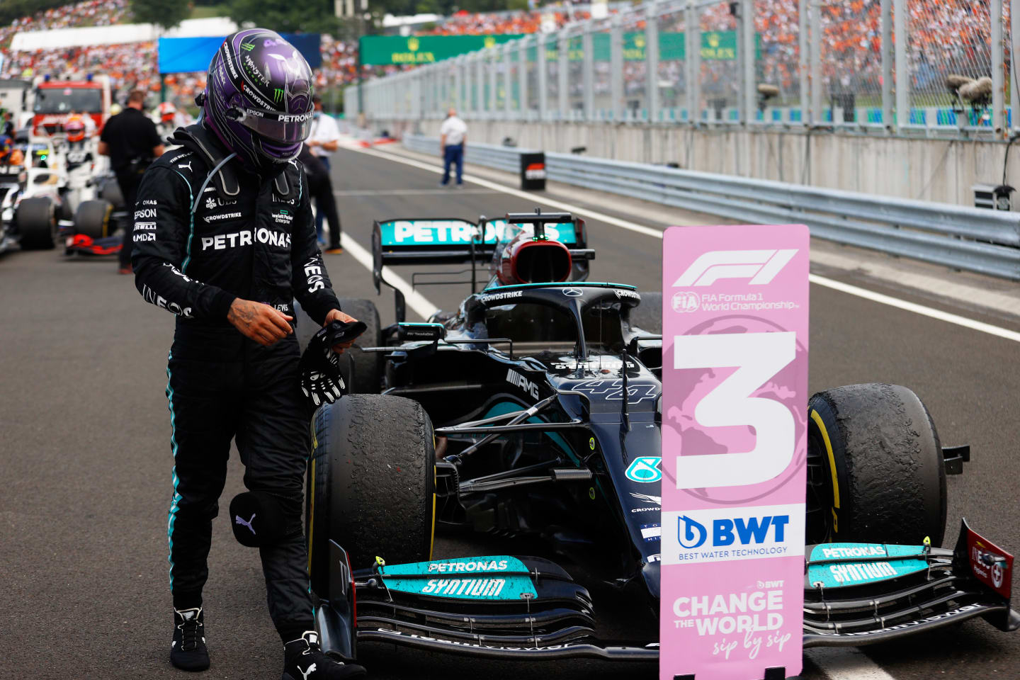 BUDAPEST, HUNGARY - AUGUST 01: Third placed Lewis Hamilton of Great Britain and Mercedes GP walks