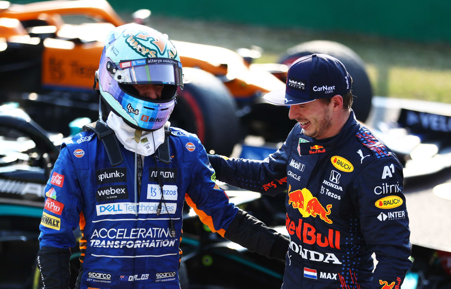 MONZA, ITALY - SEPTEMBER 11: Second place finisher Max Verstappen of Netherlands and Red Bull Racing talks with third place finisher Daniel Ricciardo of Australia and McLaren F1 in parc ferme during the Sprint ahead of the F1 Grand Prix of Italy at Autodromo di Monza on September 11, 2021 in Monza, Italy. (Photo by Bryn Lennon/Getty Images)