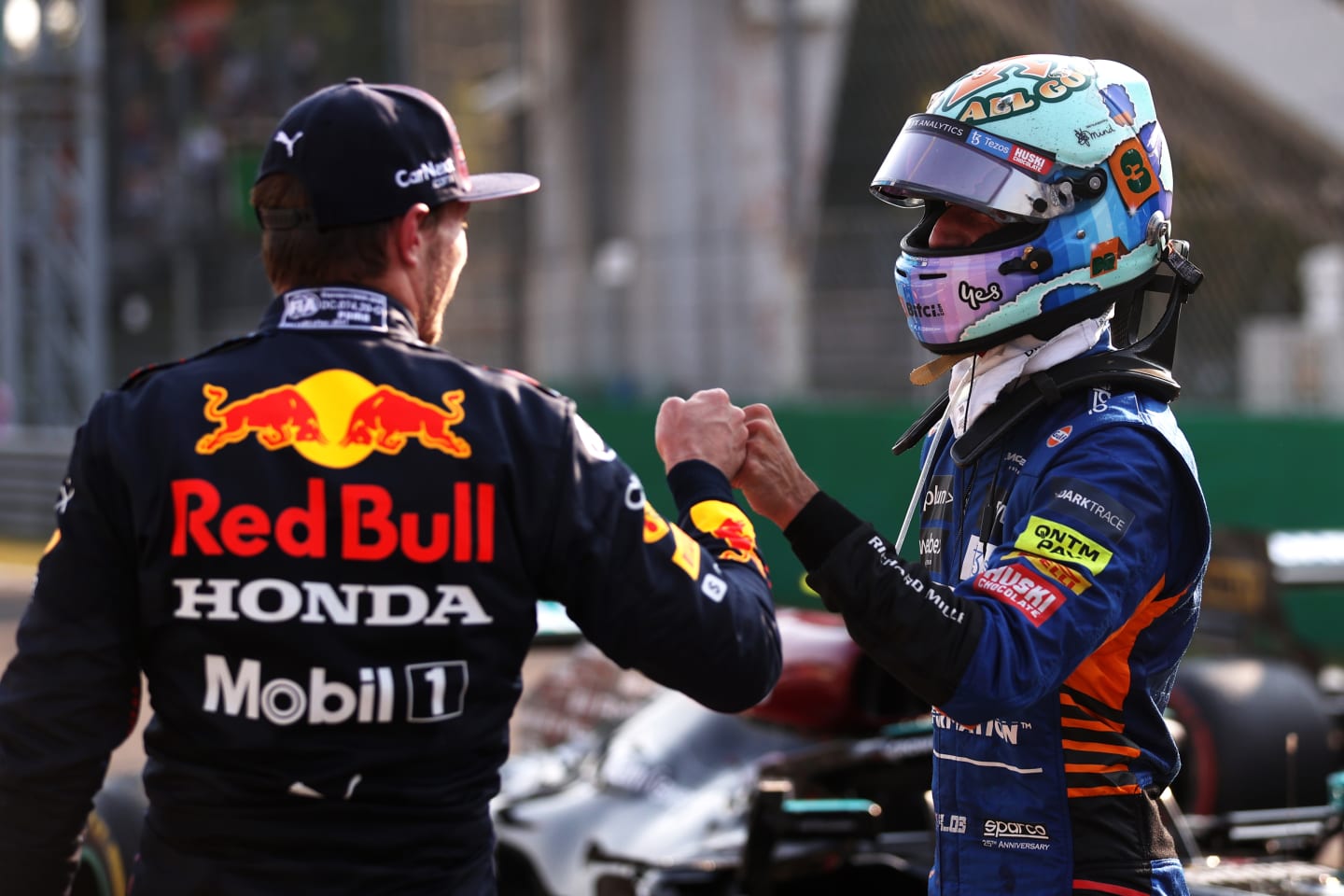 MONZA, ITALY - SEPTEMBER 11: Second place finisher Max Verstappen of Netherlands and Red Bull Racing talks with third place finisher Daniel Ricciardo of Australia and McLaren F1 in parc ferme during the Sprint ahead of the F1 Grand Prix of Italy at Autodromo di Monza on September 11, 2021 in Monza, Italy. (Photo by Lars Baron/Getty Images)