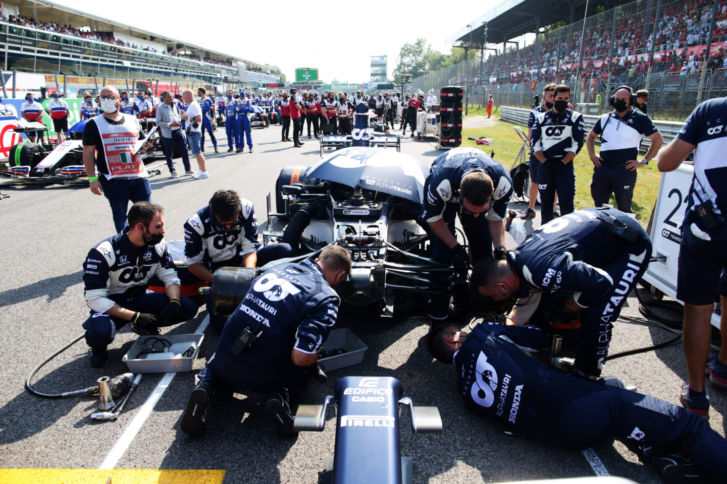 MONZA, ITALY - SEPTEMBER 12: The Scuderia AlphaTauri team work on the grid during the F1 Grand Prix