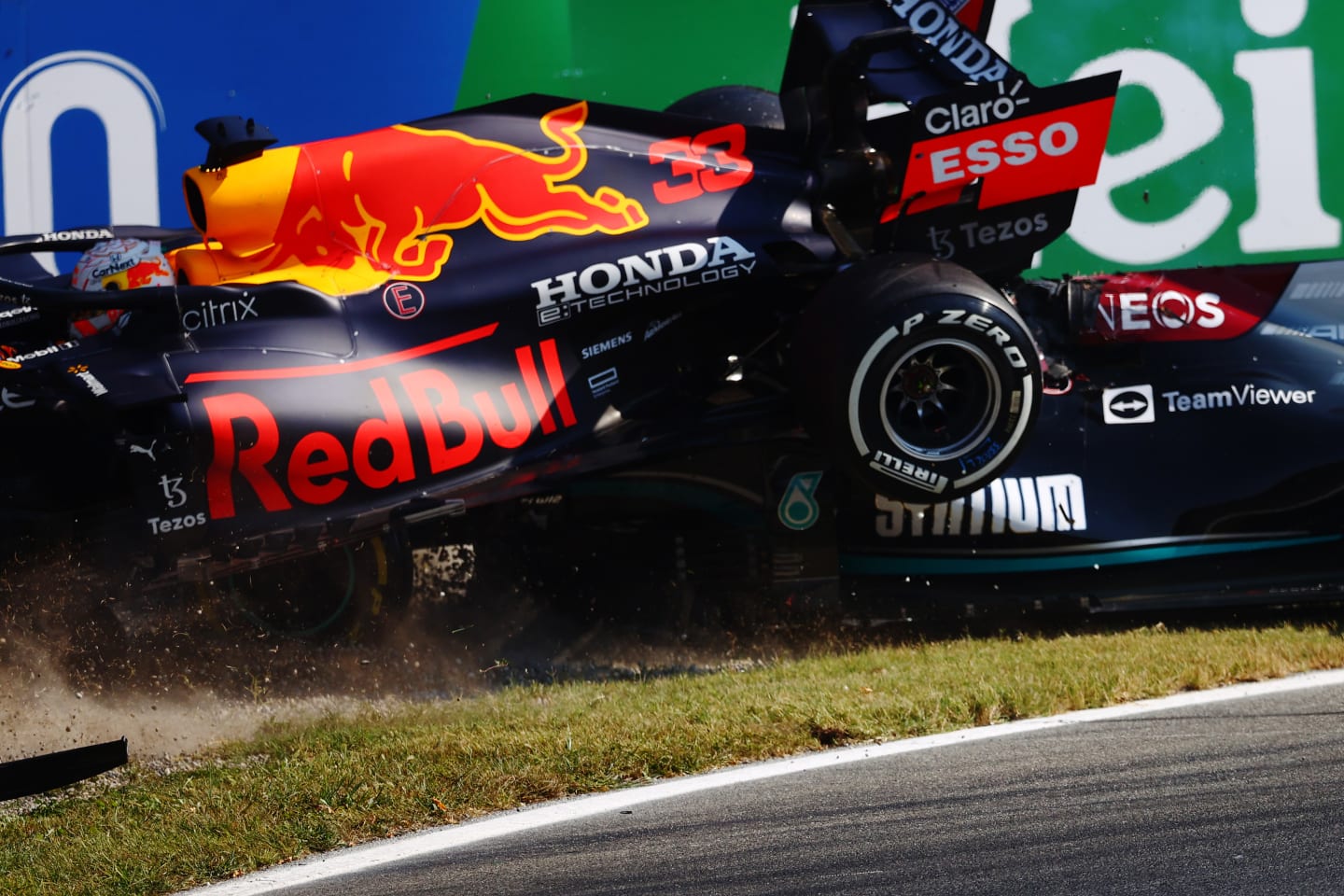 MONZA, ITALY - SEPTEMBER 12: Max Verstappen of the Netherlands driving the (33) Red Bull Racing RB16B Honda and Lewis Hamilton of Great Britain driving the (44) Mercedes AMG Petronas F1 Team Mercedes W12 crash during the F1 Grand Prix of Italy at Autodromo di Monza on September 12, 2021 in Monza, Italy. (Photo by Dan Istitene - Formula 1/Formula 1 via Getty Images)