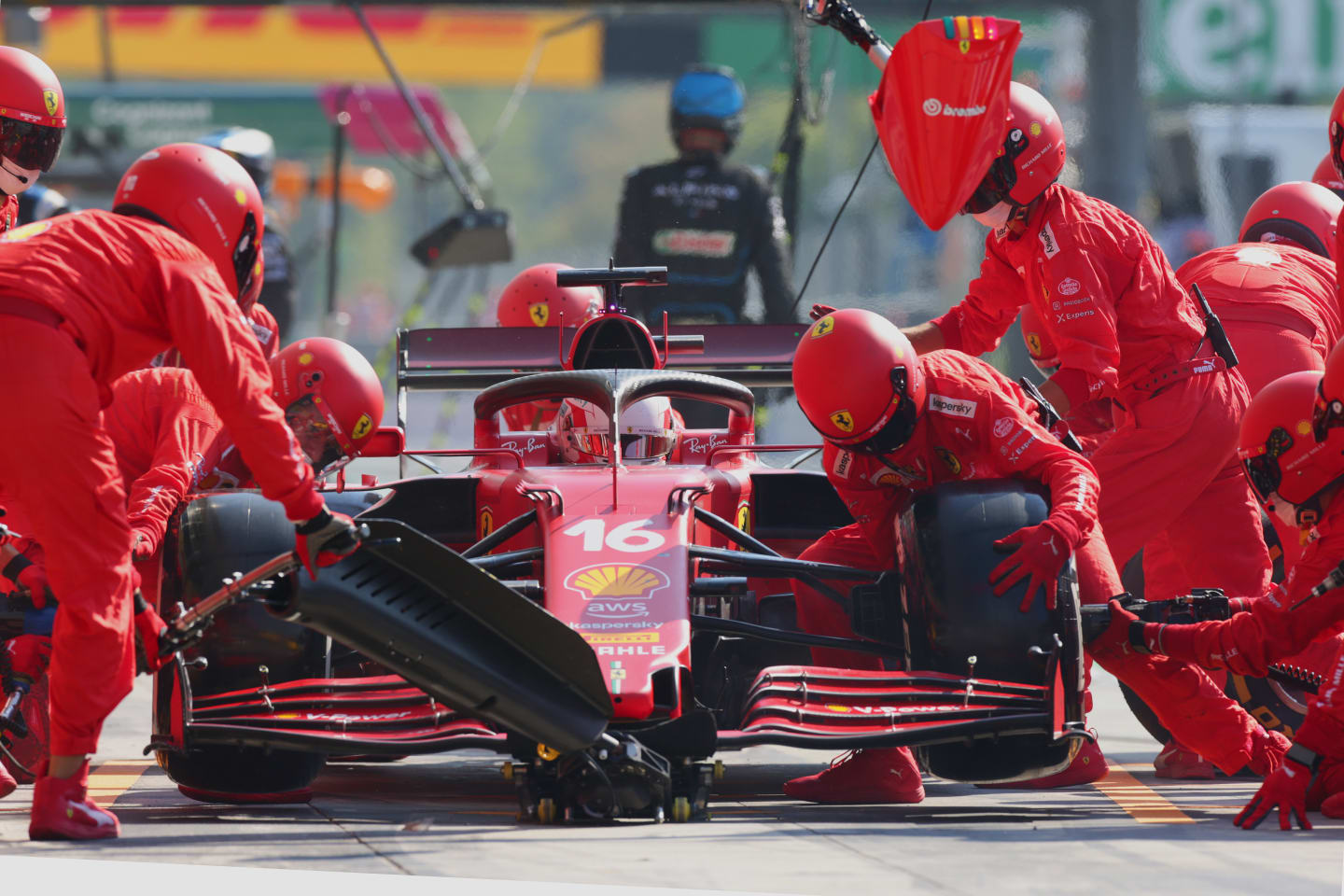 MONZA, ITALY - SEPTEMBER 12: Charles Leclerc of Monaco driving the (16) Scuderia Ferrari SF21 makes a pitstop during the F1 Grand Prix of Italy at Autodromo di Monza on September 12, 2021 in Monza, Italy. (Photo by Peter Fox/Getty Images)